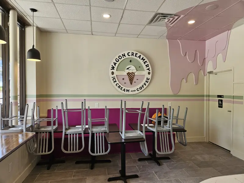 Future seating area, with chairs up on top of tables for now