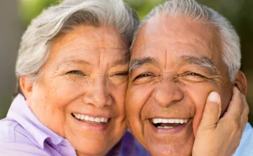 Image of smiling older woman and man together, with &#039;May 28' in one corner
