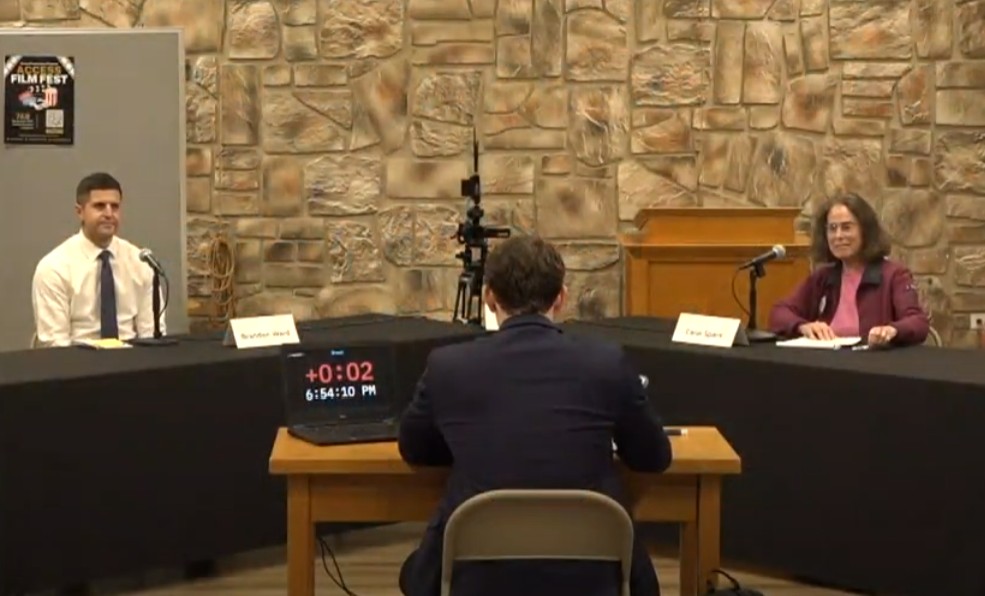 Screen shot from the debate video of both candidates and the moderator at the debate
