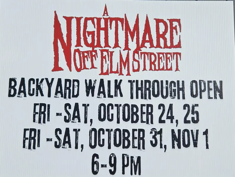 Sign with text: A NIGHTMARE OFF ELM STREET BACKYARD WALK THROUGH OPEN FRI - SAT, OCTOBER 24, 25 FRI - SAT, OCTOBER 31, NOV 1 6 - 9 PM