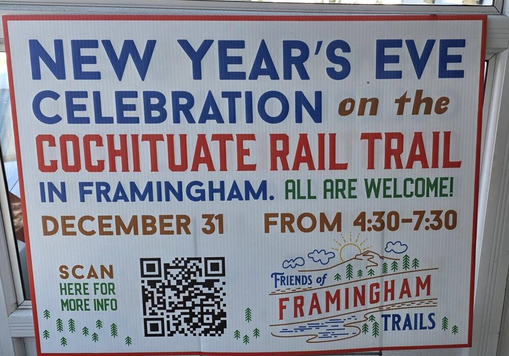 Sign: New Year's Eve Celebration on the Cochituate Rail Trail in Framingham. All are welcome! December 31 from 4:30 to 7:30. Plus QR code to scan for more info and the Friends of Framingham Trails logo. Photo by Leora Mallach