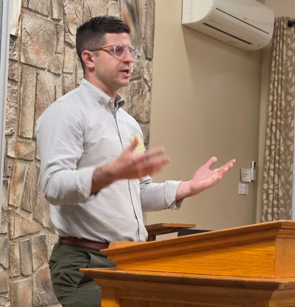City Councilor Brandon Ward speaking at the meeting