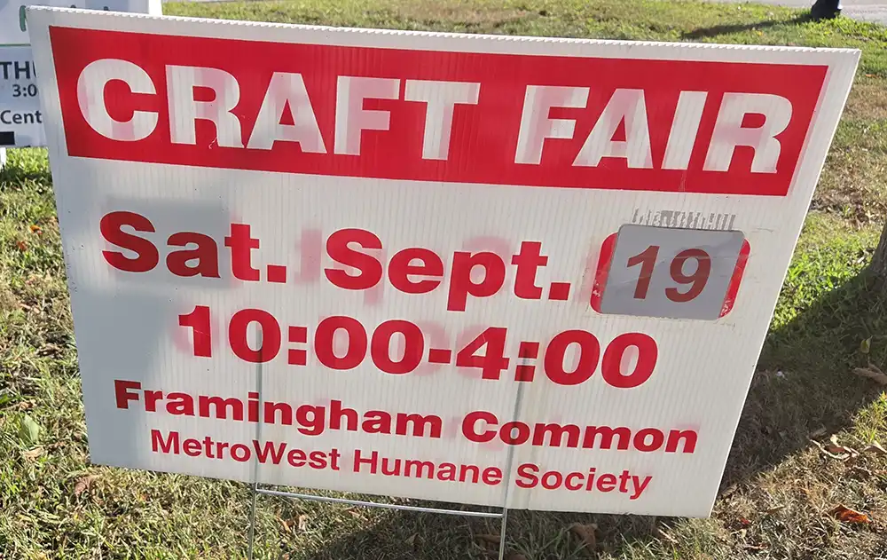 Sign saying CRAFT FAIR Sat. Sept. 19 10:00-4:00 Framingham Common MetroWest Humane Society